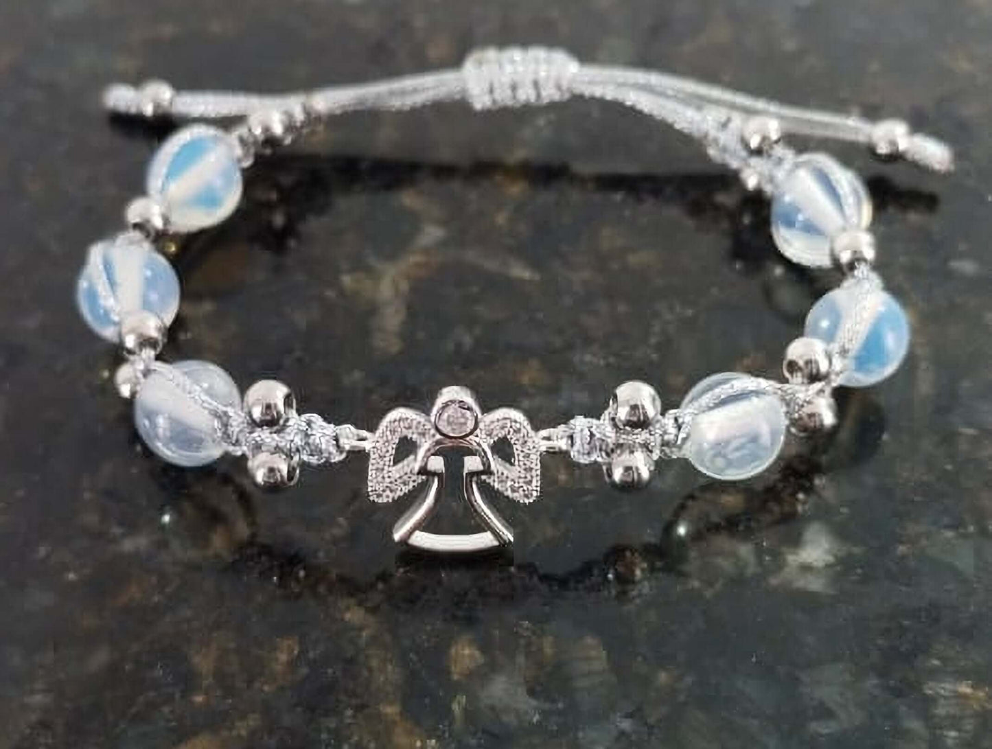 Ladies bracelet with angel and opal